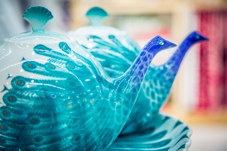 two beautiful antique teapots in blue colorの写真素材