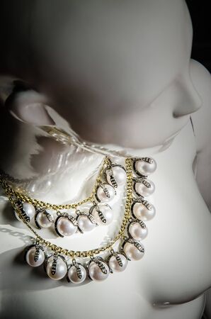 White mannequin with luxury necklace close upの写真素材
