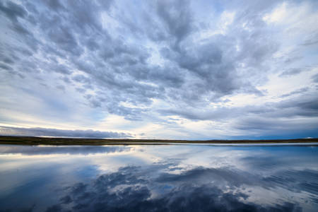 beautiful summer lake, reflection and blue sky landscapeの写真素材