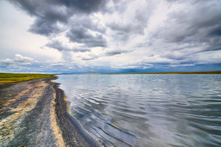 Beautiful natural lake landscape against the cloudy sky