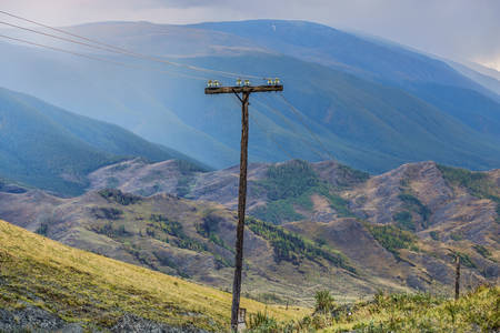 summer mountain and blue sky landscape with wooden electric poleの写真素材