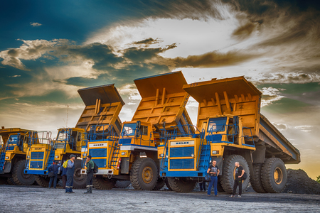 Big yellow mining trucks at worksiteのeditorial素材