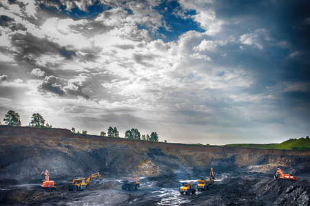 NOVOKUZNETSK, RUSSIA - JULY 26, 2016: Big yellow mining trucks and excavators at worksiteのeditorial素材