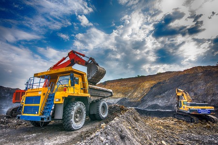 NOVOKUZNETSK, RUSSIA - JULY 26, 2016: Big yellow mining trucks and excavators at worksiteのeditorial素材