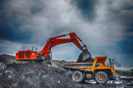 NOVOKUZNETSK, RUSSIA - JULY 26, 2016: Big yellow mining trucks and excavators at worksiteのeditorial素材
