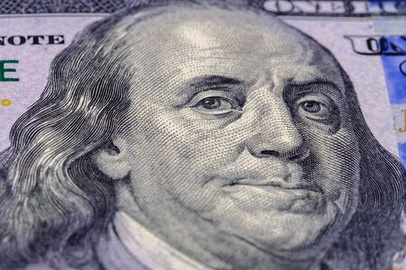Macro photography Portrait of Benjamin Franklin on banknote one hundred american dollars. Close up view.の写真素材