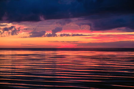 Sea waves at sunset.の写真素材