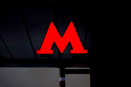 Moscow, Russia, February, 12, 2018. Emblem, the red letter "M" of the Moscow metro on dark background.のeditorial素材