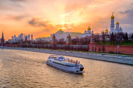 Moscow - 17 April 2021: Beautiful sunset landscape with evening view at Moscow Kremlin. Pleasure ship goes along the Moscow river.のeditorial素材