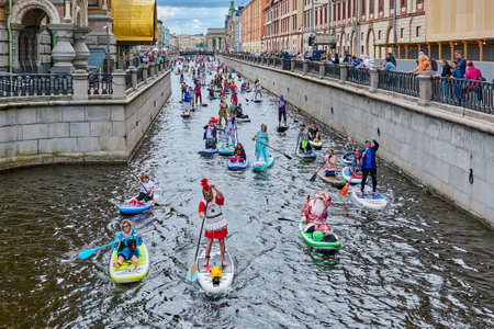 St. Petersburg, Russia - July 31, 2021: Fontanka SUP festival. Stand up paddle surfing carnival procession on the water.のeditorial素材