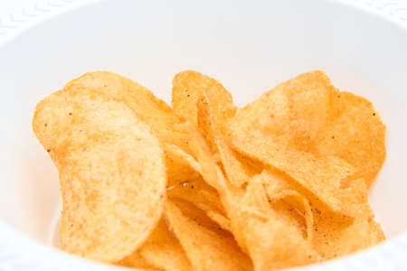Potato Chips in a white bowlの写真素材