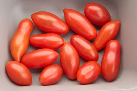 cherub tomato in grey bowlの写真素材