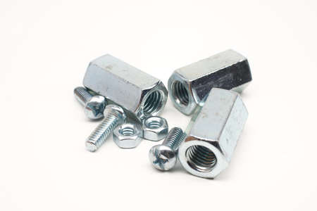 head screw bolts, hex nuts, hex coupling nuts isolated on white backgroundの写真素材