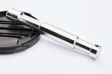 Baby 5/8" Grip Arm Pin on lens cap (82mm) isolated on whiteの写真素材