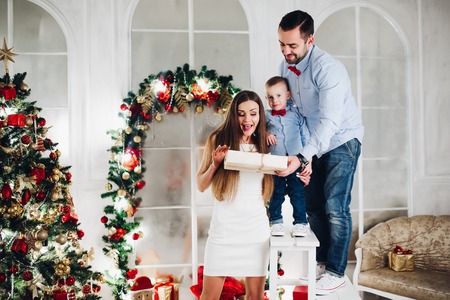 Father and son giving mother a present.の写真素材