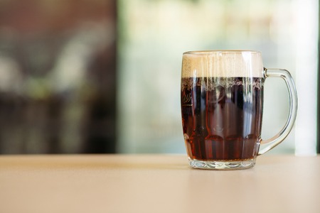 Horizontal photo of glass cup full of beer.の写真素材