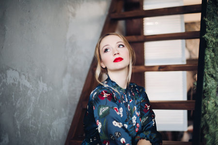 Portrait of beautiful woman having make up and red lips.