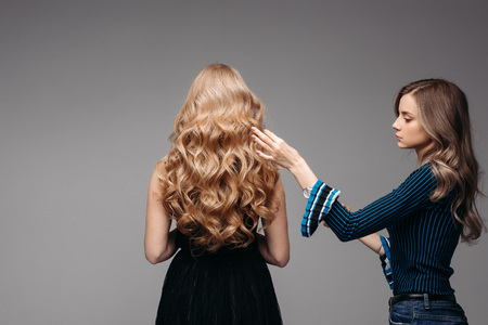 Stunning woman with perfect wavy blonde hair.の写真素材