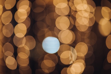 Abstract blurred circles Color Bokeh against a dark backgroundの写真素材