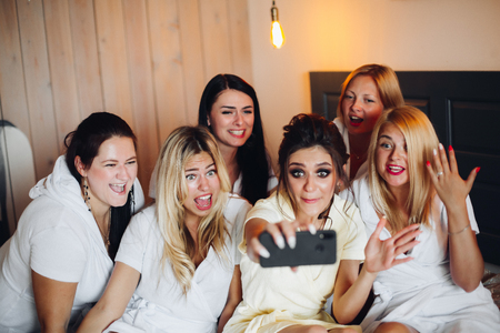 Hen party with a bride in hotel.の写真素材