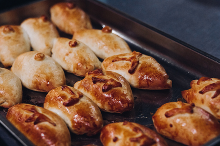 Delicious fresh baked flavored buns set made of sweet dough.の写真素材