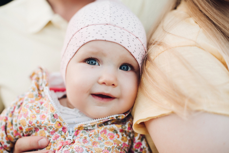 Close up of surprised babys face with lightly opened mouth.の写真素材