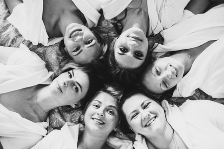 Beautiful and positive bride maids having fun on hen party.の写真素材