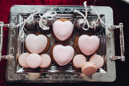 heart-shaped Cake. Beautiful delicious heart shaped cakes, pink color. Sweets brilliant, sweet.