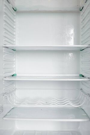 Front view of empty refrigerator staying at homeの写真素材