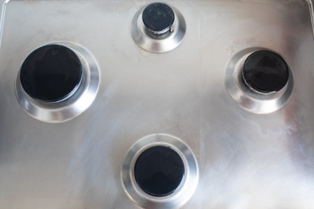 Polished gas cooker after washing.Perfectly clean gas cooker after being washed with polishing...