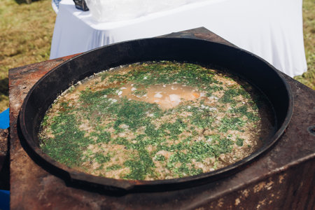 Cauldron of delicious soup outdoors.