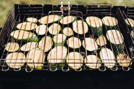 Cabbage on grill.Close-up of raw sliced squash being grilled on outdoors grill equipment.