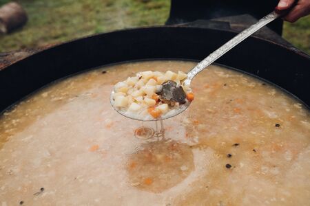 Closeup of delicious soup with potatos and carrotsの写真素材