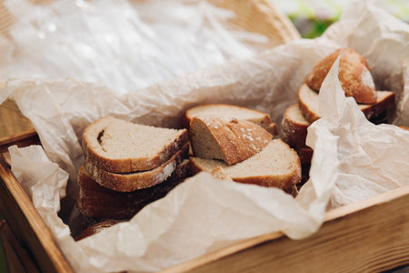 Freshly baked bread cut in a basket.