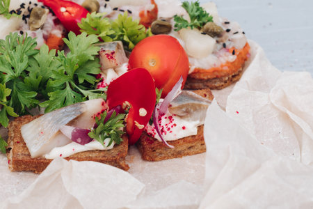 Appetizing sandwich with bacon decorating greenery serving on plate ready for eating close-up