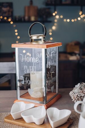 Big aglass candlestick standing on a tableの写真素材