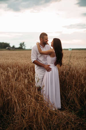 Loving couple in the field.の写真素材