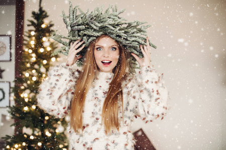 Charming young woman with a fir head piece