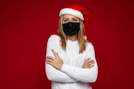 Christmas concept photo of woman in a protective maskの写真素材