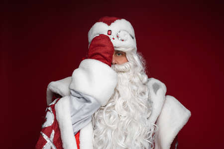 Santa covering on half of his face.の写真素材