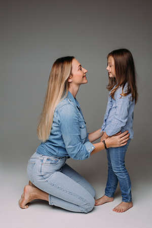 Adorable family photo session of mother and laughterの写真素材