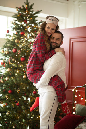 beautiful couple in love have a lot of fun together in christmas eveの写真素材