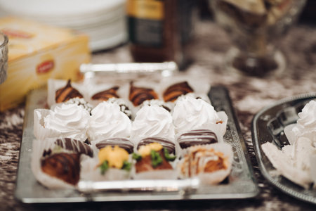 a lot of different cakes, cupcakes and other sweets