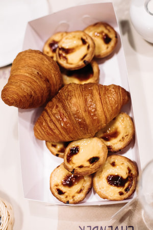 picture of a box with fresh croissant and cookiesの写真素材