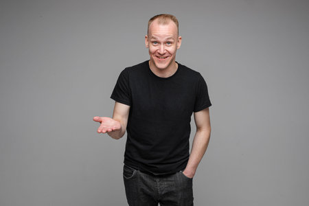 Smiling man with hand gesture.の写真素材