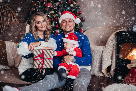 Happy father and son in Santa costume.