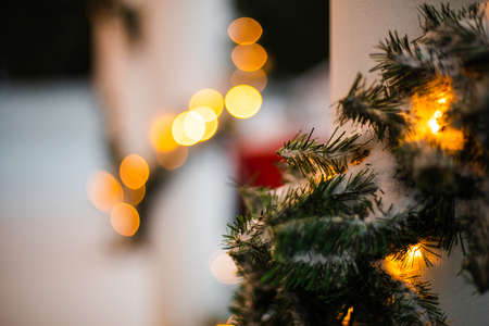 House decorated for Christmas with red carの写真素材