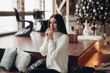 Gorgeous girl with long dark hair with little white dwarf.