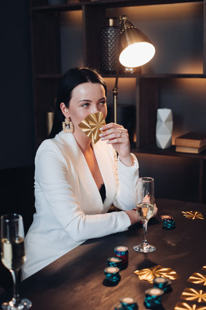 Mystic woman with golden cards at poker table.の写真素材