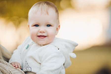 Close up of surprised babys face with lightly opened mouth.
